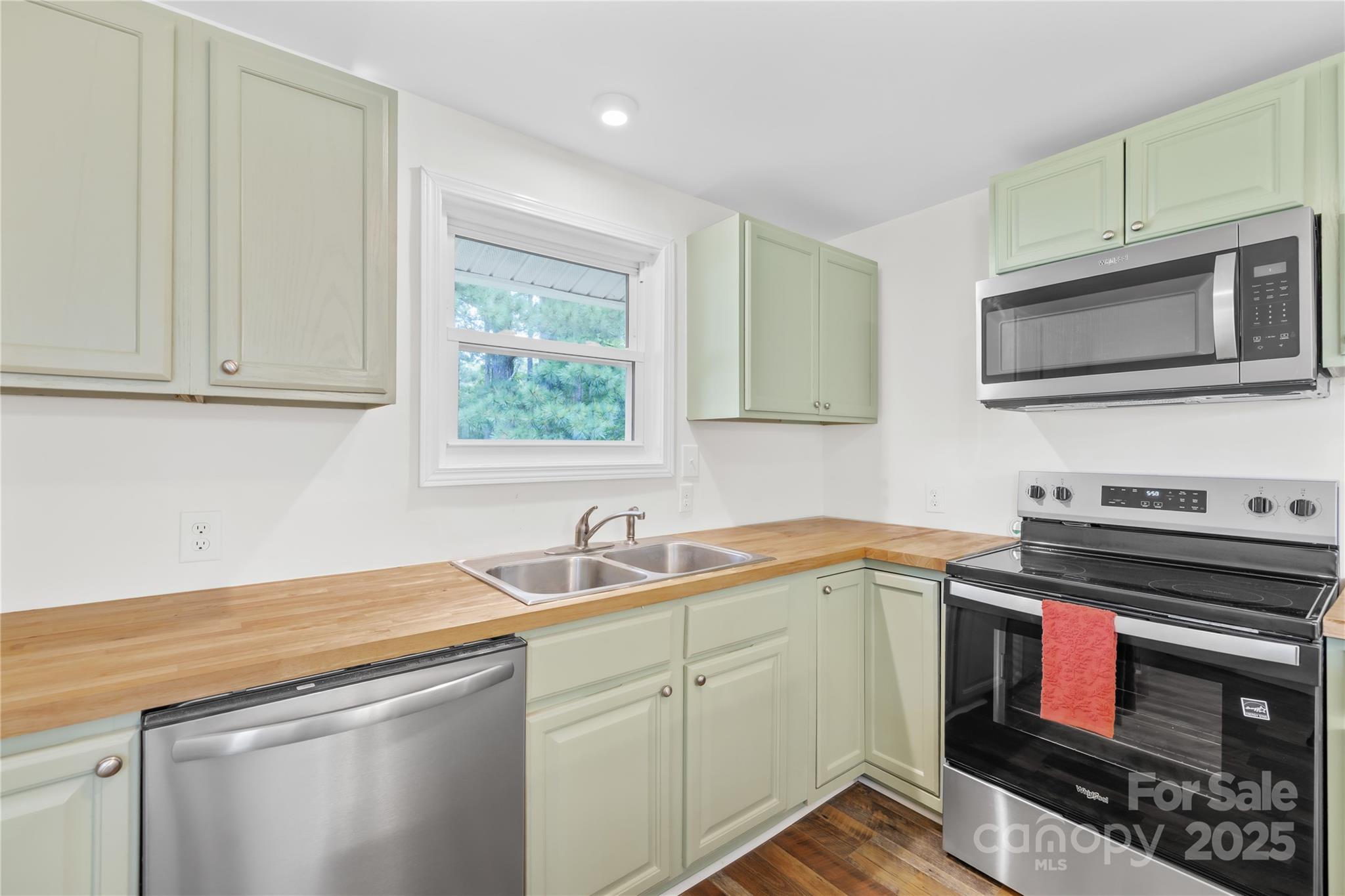 2333 Howells Ferry Road Hickory Grove, SC 29717 - Photo 24 of 30 a kitchen with stainless steel appliances a stove sink and microwave