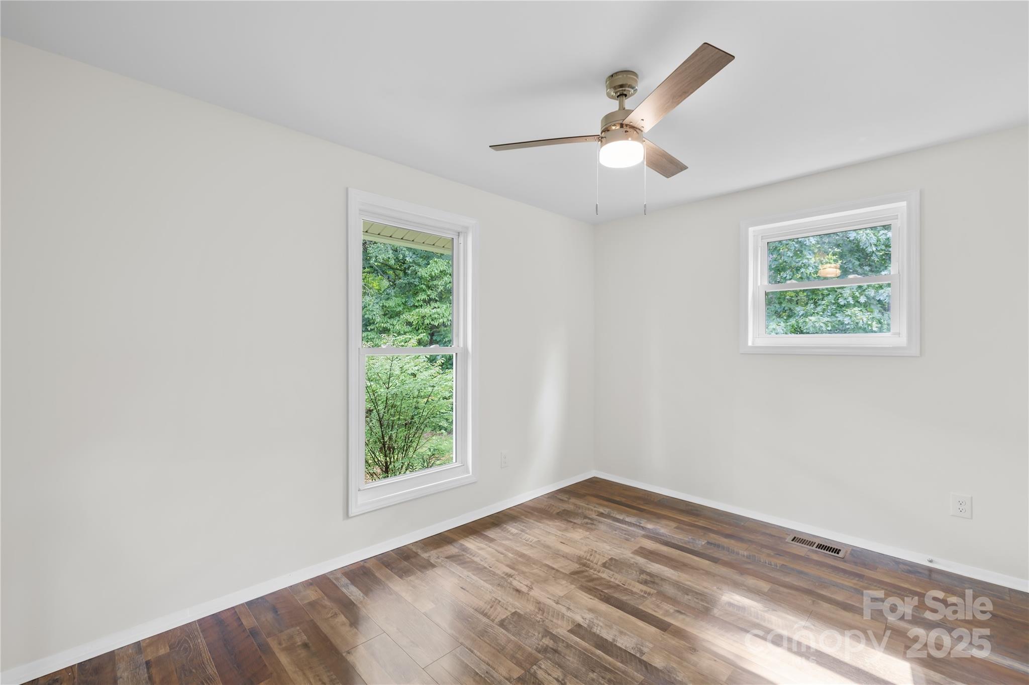 2333 Howells Ferry Road Hickory Grove, SC 29717 - Photo 28 of 30 a view of empty room with wooden floor and fan