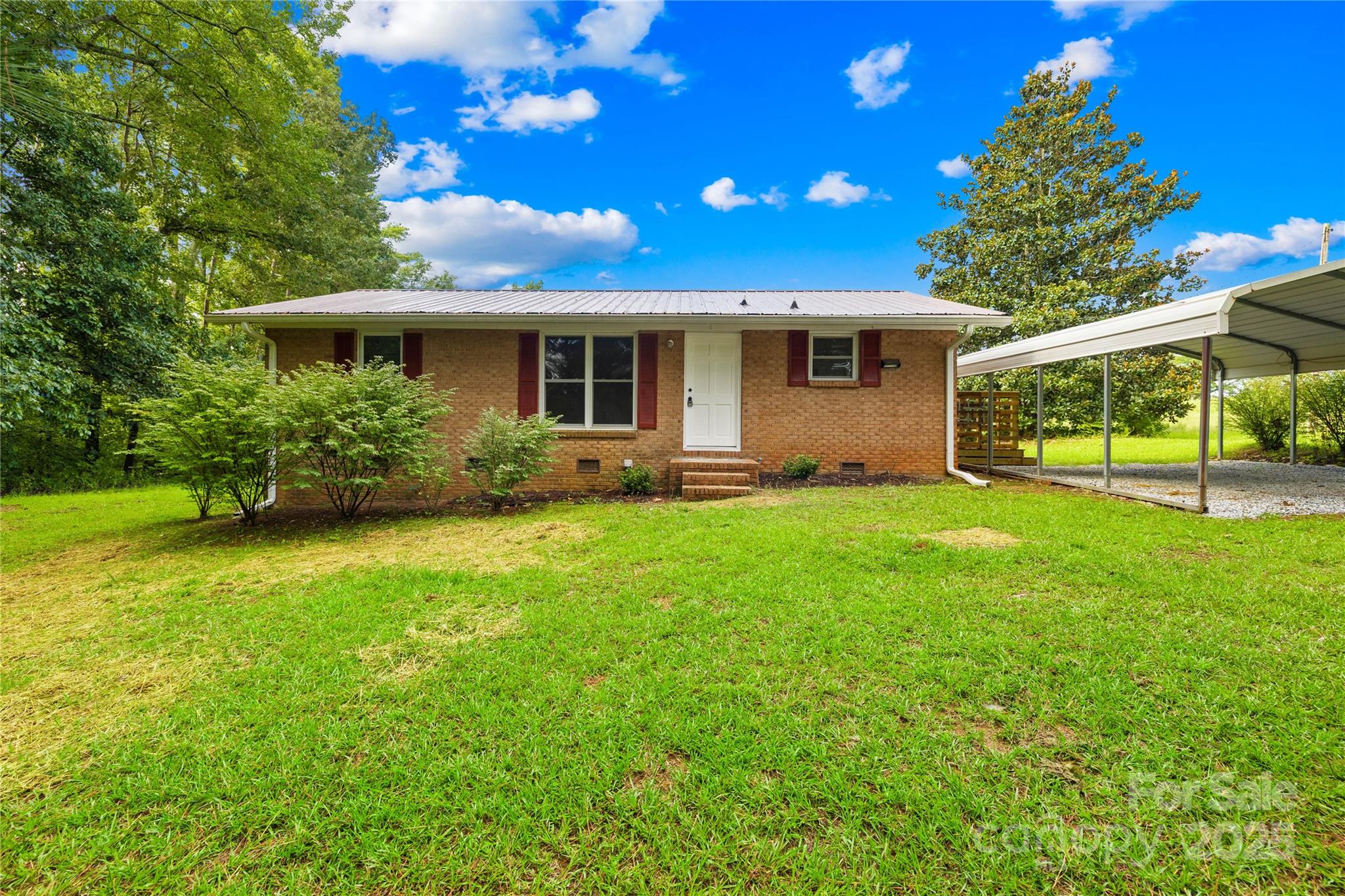 2333 Howells Ferry Road Hickory Grove, SC 29717 - Photo 3 of 30 a front view of a house with garden