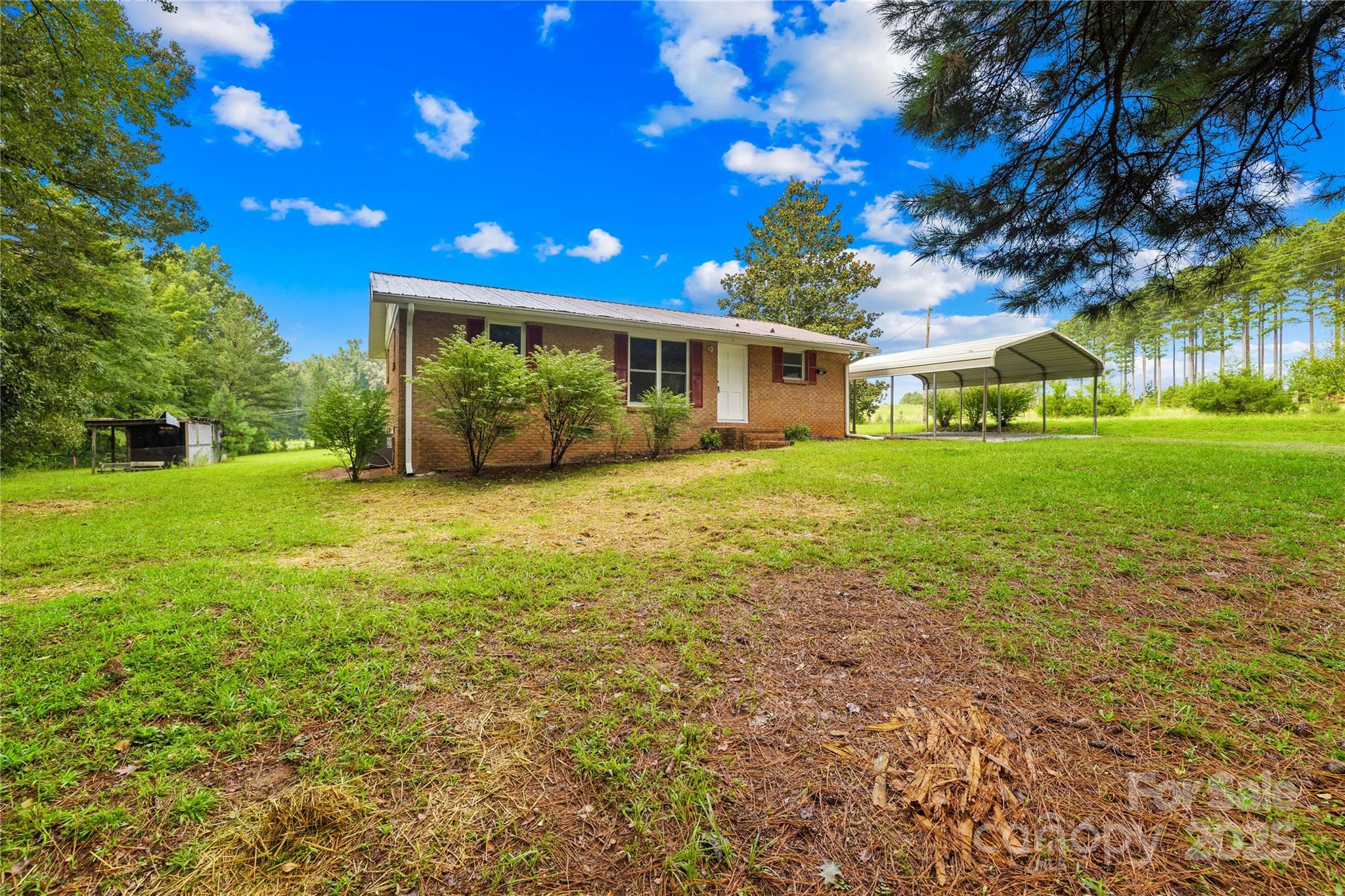 2333 Howells Ferry Road Hickory Grove, SC 29717 - Photo 5 of 30 a view of a house with a big yard and large trees