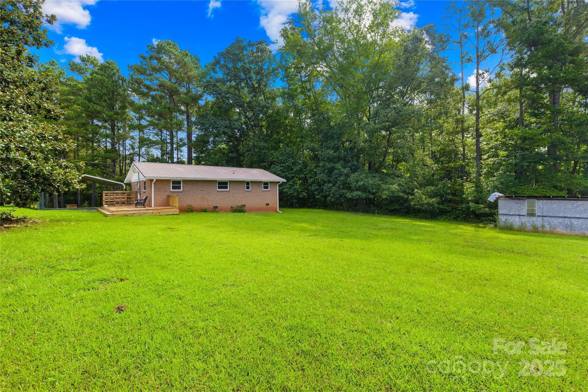 2333 Howells Ferry Road Hickory Grove, SC 29717 - Photo 7 of 30 a view of a backyard with a small house