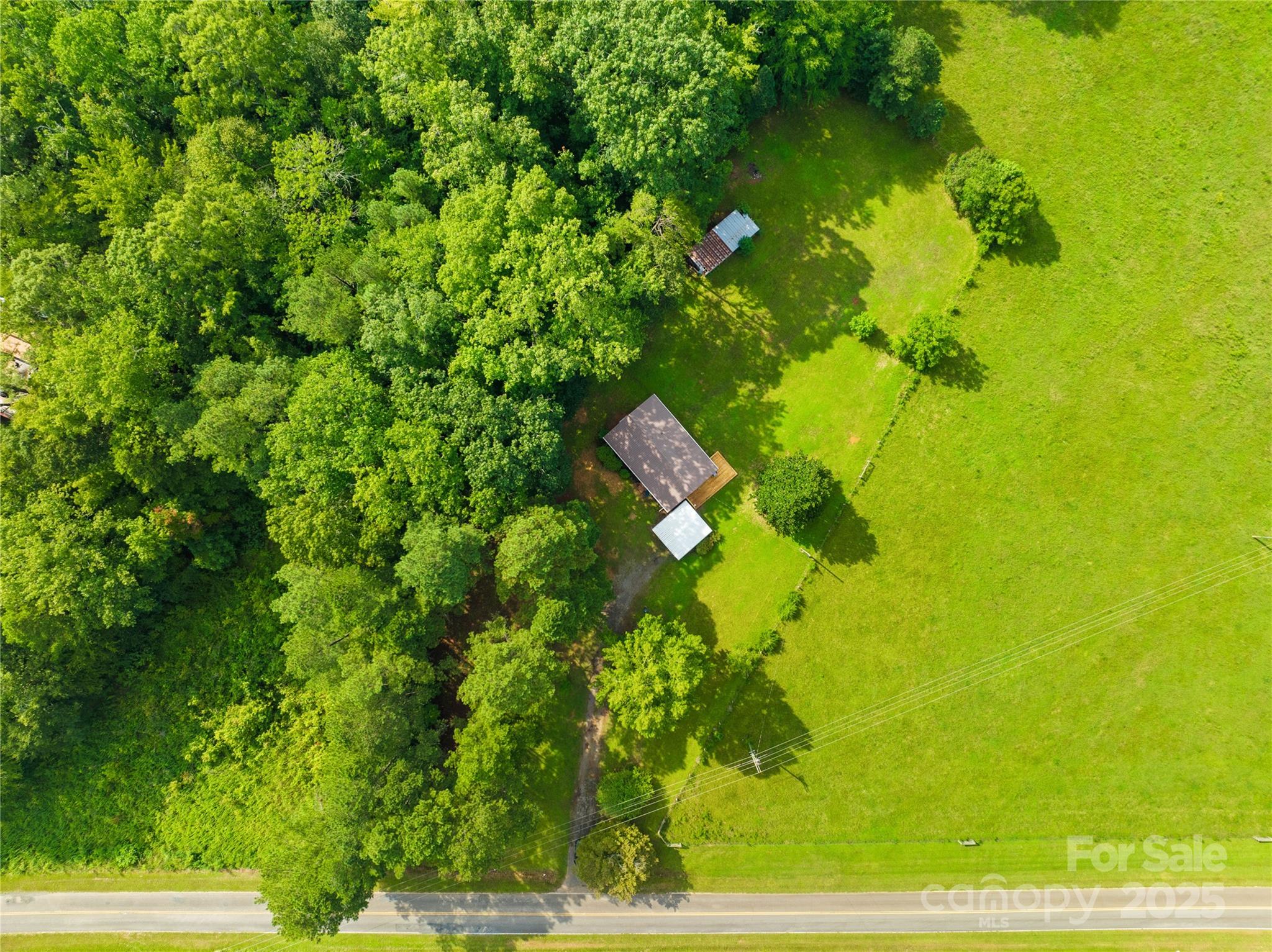 2333 Howells Ferry Road Hickory Grove, SC 29717 - Photo 9 of 30 a backyard of a building with lots of green space