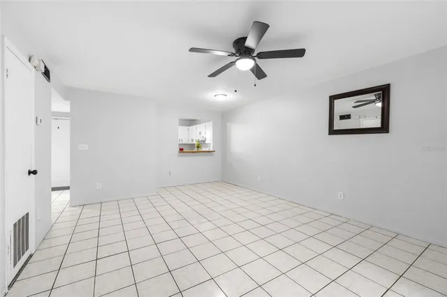 a view of an empty room and window