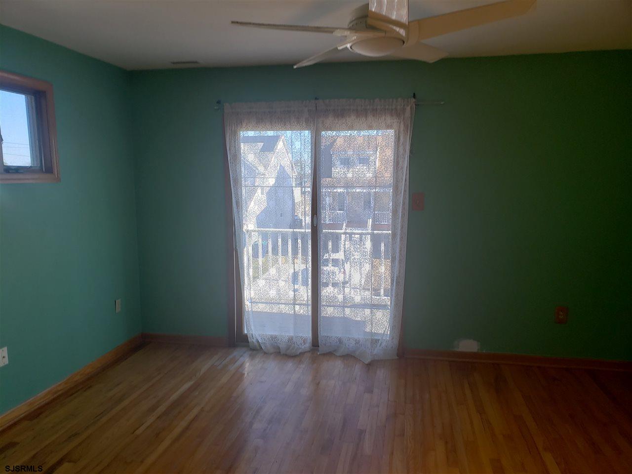 16 Vardon Road Brigantine, NJ 08203 - Photo 18 of 20 an empty room with wooden floor and windows