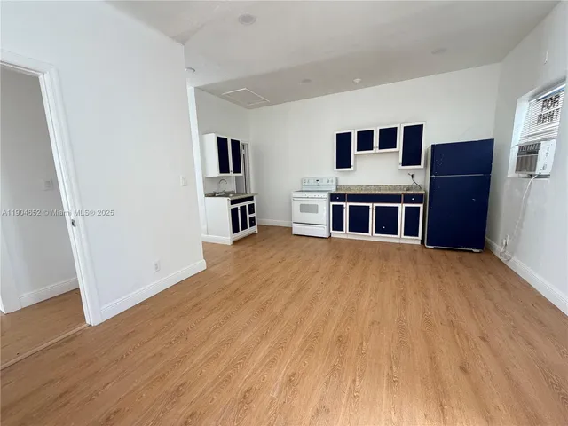 a view of a livingroom with furniture and wooden floor