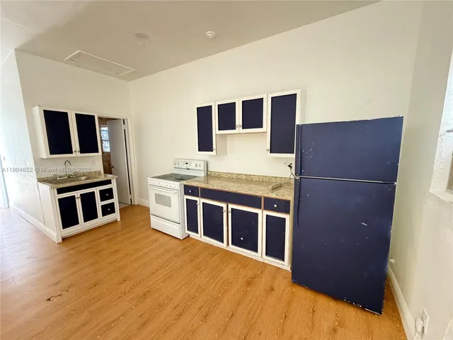 a kitchen with stainless steel appliances a stove and a refrigerator