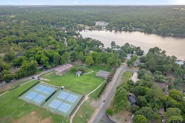 an aerial view of a house with outdoor space lake view