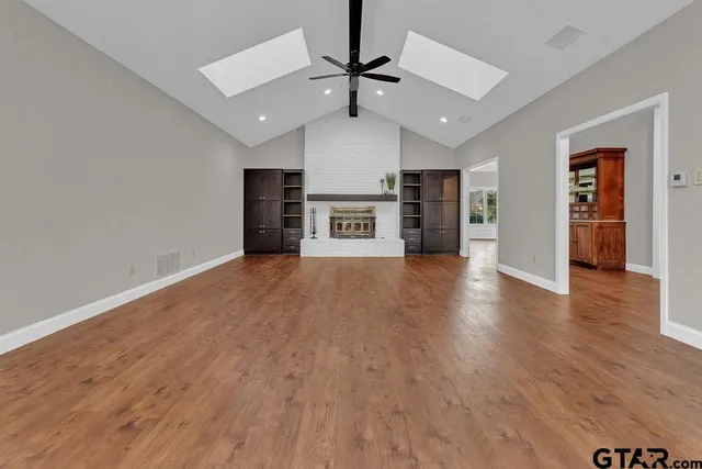 a view of a livingroom with a kitchen