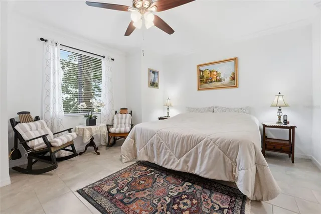 a bed room with a bed and a chandelier