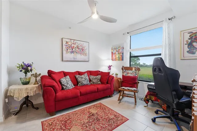 a living room with furniture rug and a window