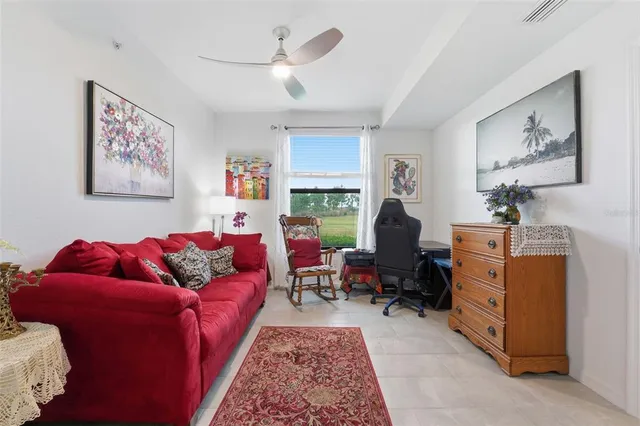 a living room with furniture workspace and a window