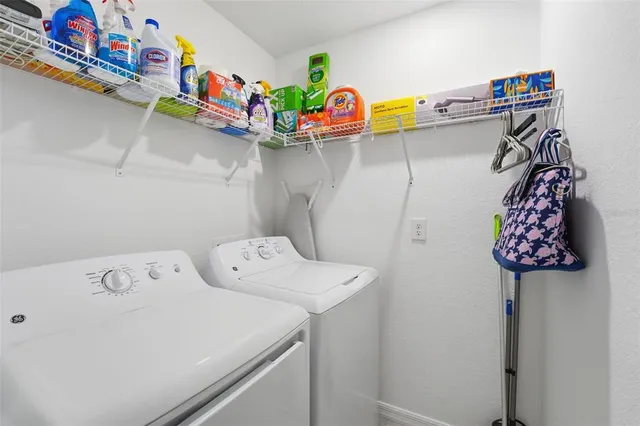 a utility room with dryer and washer