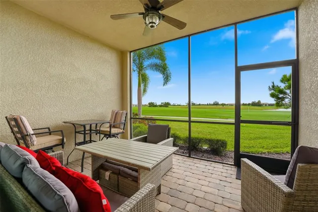 a view of a patio with table and chairs a barbeque with wooden floor and fence