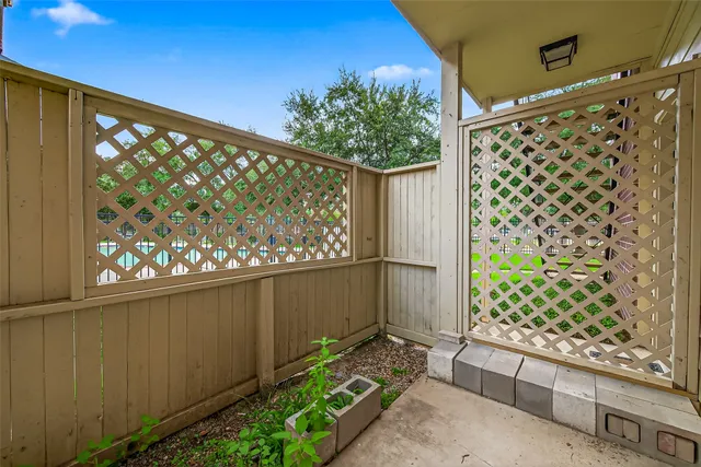 a view of a back yard of the house and tree