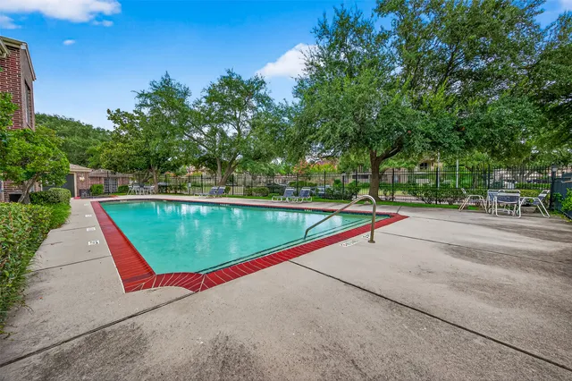 a view of swimming pool with a yard