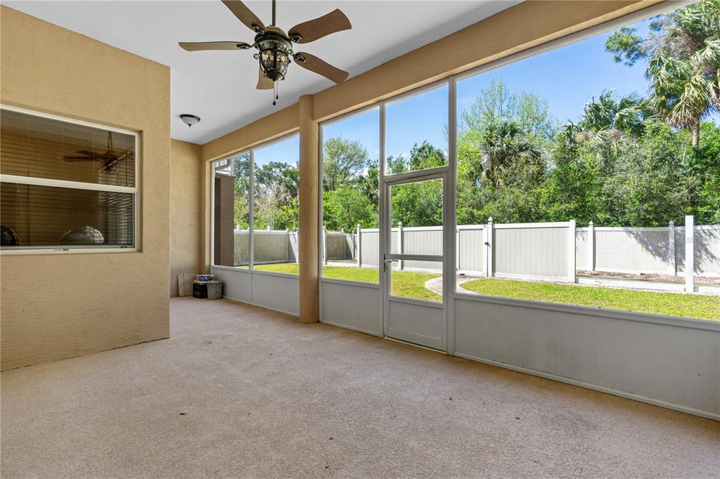 32 Seneca Path Palm Coast, FL 32164 - Photo 11 of 50 wooden floor to ceiling window and an outdoor view