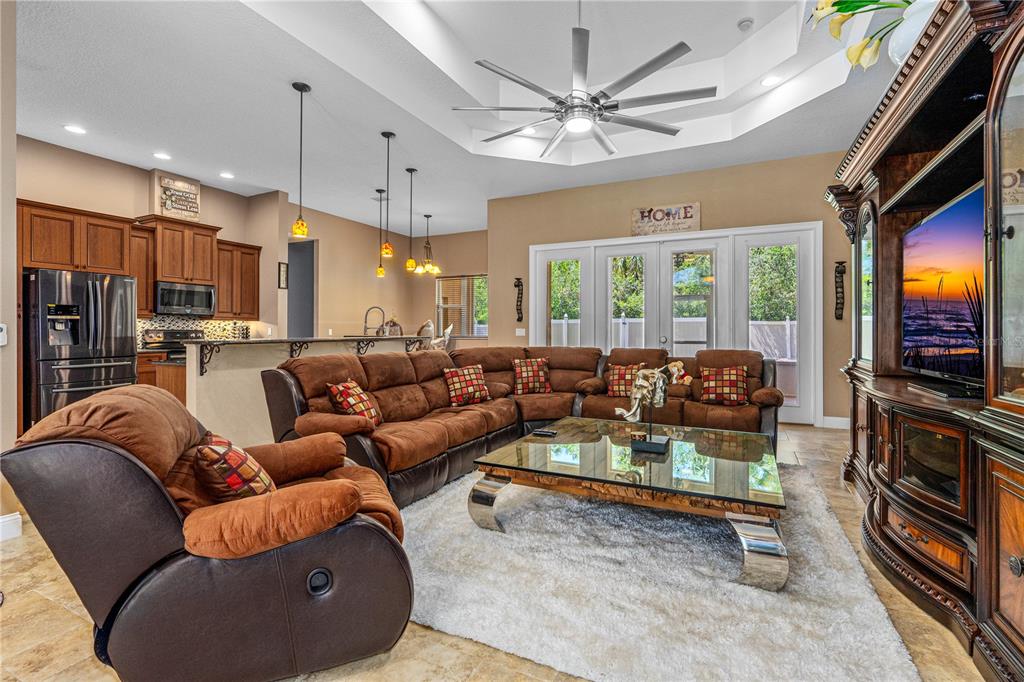 32 Seneca Path Palm Coast, FL 32164 - Photo 14 of 50 a living room with furniture a flat screen tv and a large window