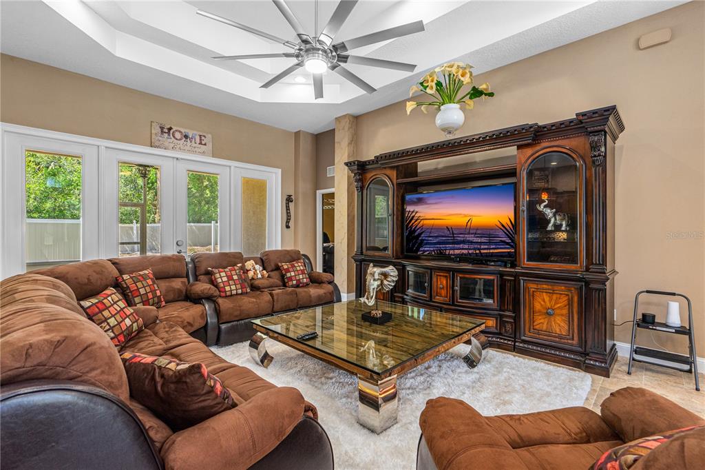 32 Seneca Path Palm Coast, FL 32164 - Photo 15 of 50 a living room with furniture and a flat screen tv