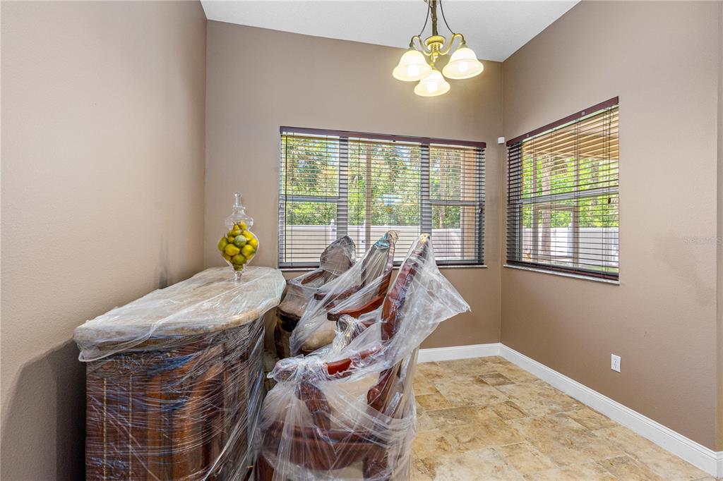 32 Seneca Path Palm Coast, FL 32164 - Photo 24 of 50 a bed sitting in a bedroom next to a window