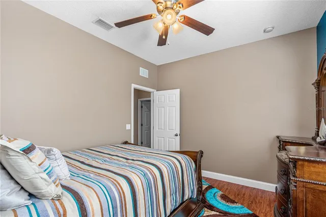 a bedroom with bed and a window