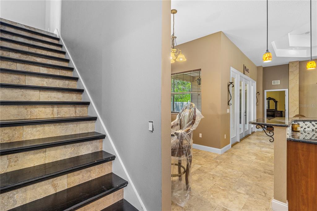 32 Seneca Path Palm Coast, FL 32164 - Photo 41 of 50 a view of a hallway with wooden floor and staircase