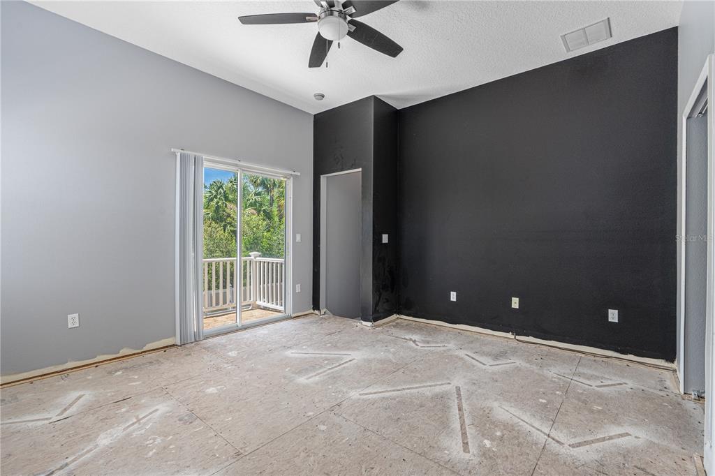 32 Seneca Path Palm Coast, FL 32164 - Photo 43 of 50 a view of a livingroom with a ceiling fan and window