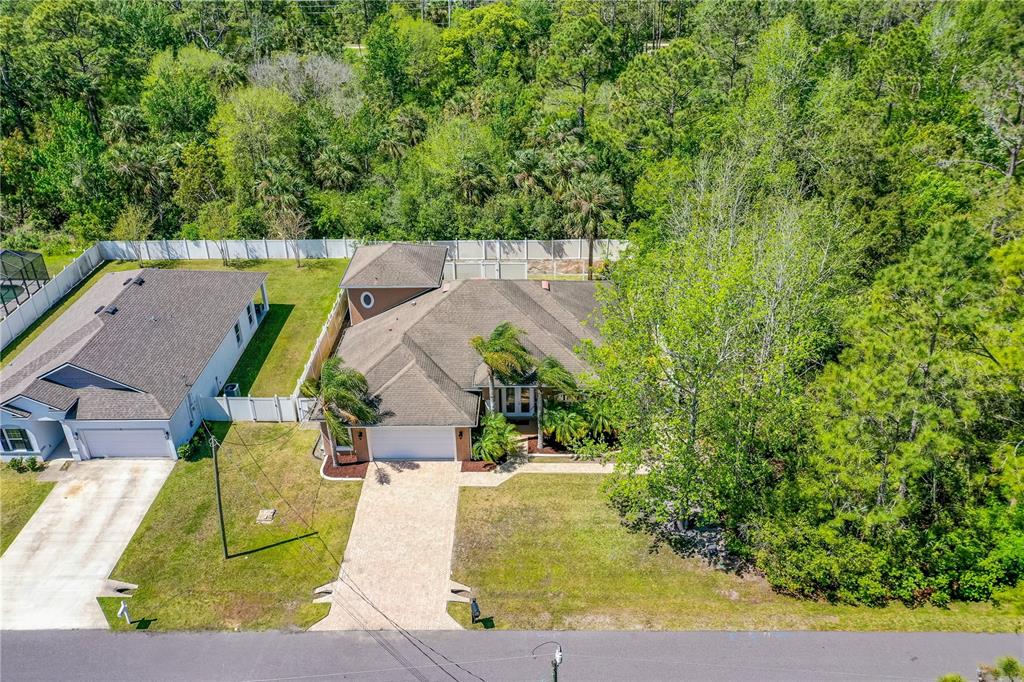 32 Seneca Path Palm Coast, FL 32164 - Photo 46 of 50 an aerial view of a house with a garden