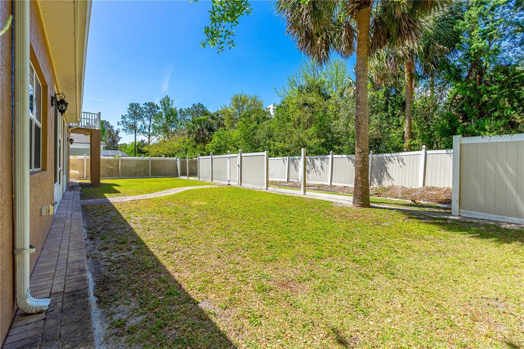 32 Seneca Path Palm Coast, FL 32164 - Photo 6 of 50 a swimming pool with an outdoor space and seating area