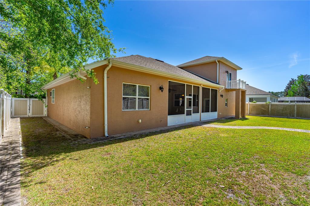 32 Seneca Path Palm Coast, FL 32164 - Photo 7 of 50 a view of a house with backyard and a tree