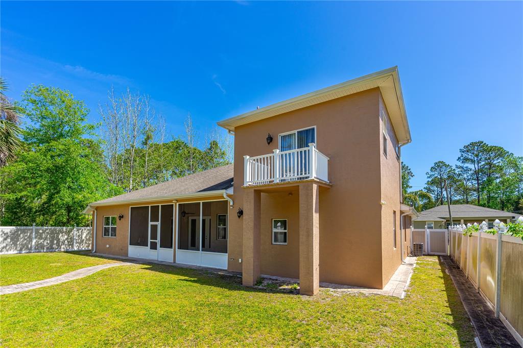 32 Seneca Path Palm Coast, FL 32164 - Photo 8 of 50 a view of a house with backyard and pool
