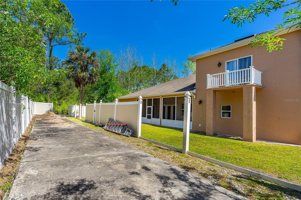 32 Seneca Path Palm Coast, FL 32164 - Photo 9 of 50 a view of a house with a backyard