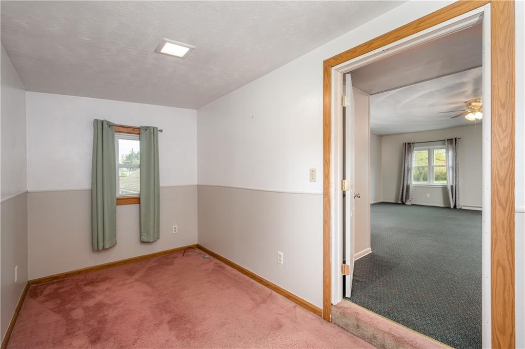 114 Weitzel Road Butler, PA 16002 - Photo 14 of 25 an empty room with windows and closet