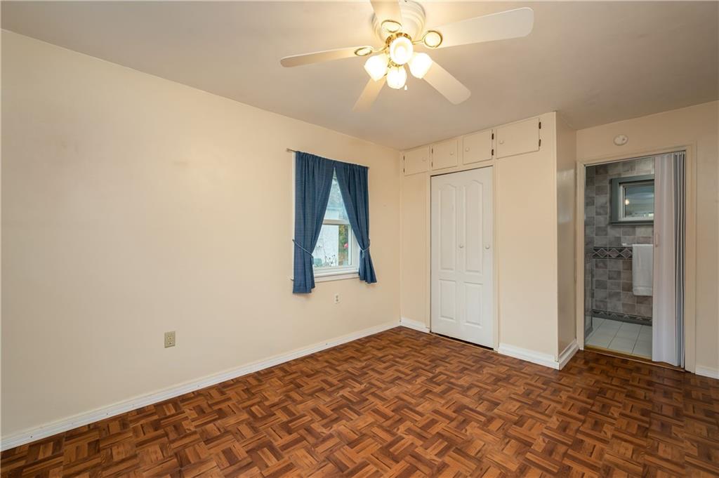 114 Weitzel Road Butler, PA 16002 - Photo 15 of 25 a bedroom with a bed and a chandelier