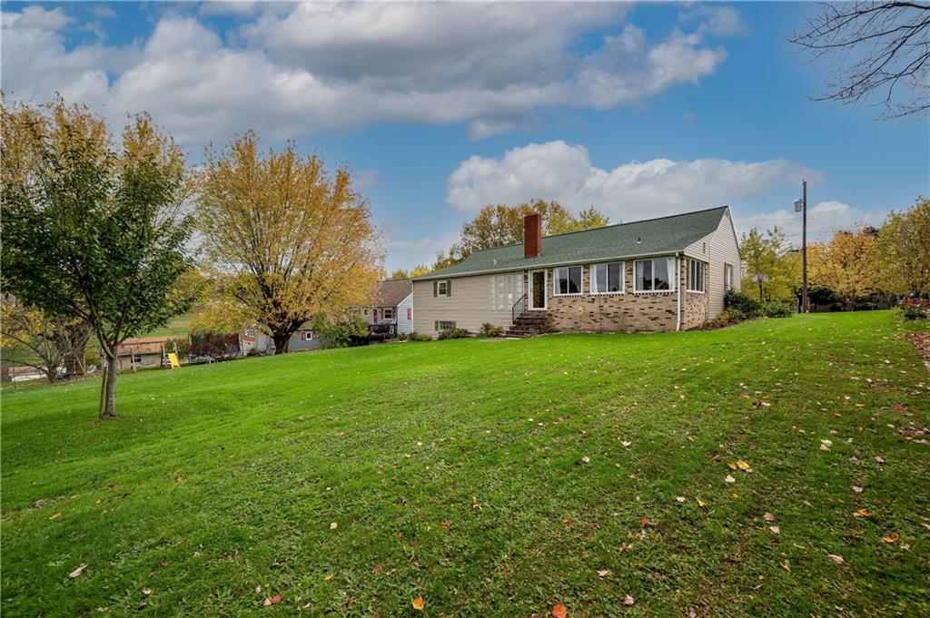 114 Weitzel Road Butler, PA 16002 - Photo 24 of 25 a view of a house with a big yard and large trees
