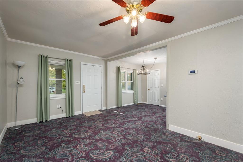 114 Weitzel Road Butler, PA 16002 - Photo 4 of 25 a view of a big room with a chandelier fan and closet area