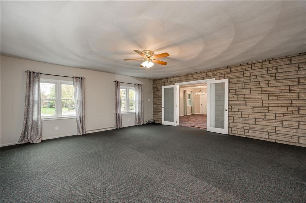 114 Weitzel Road Butler, PA 16002 - Photo 10 of 25 a view of a livingroom with a ceiling fan and window