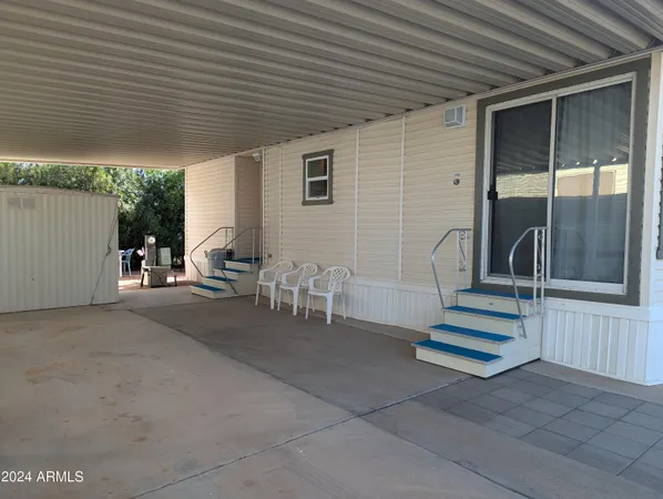 a view of house with outdoor space and seating area