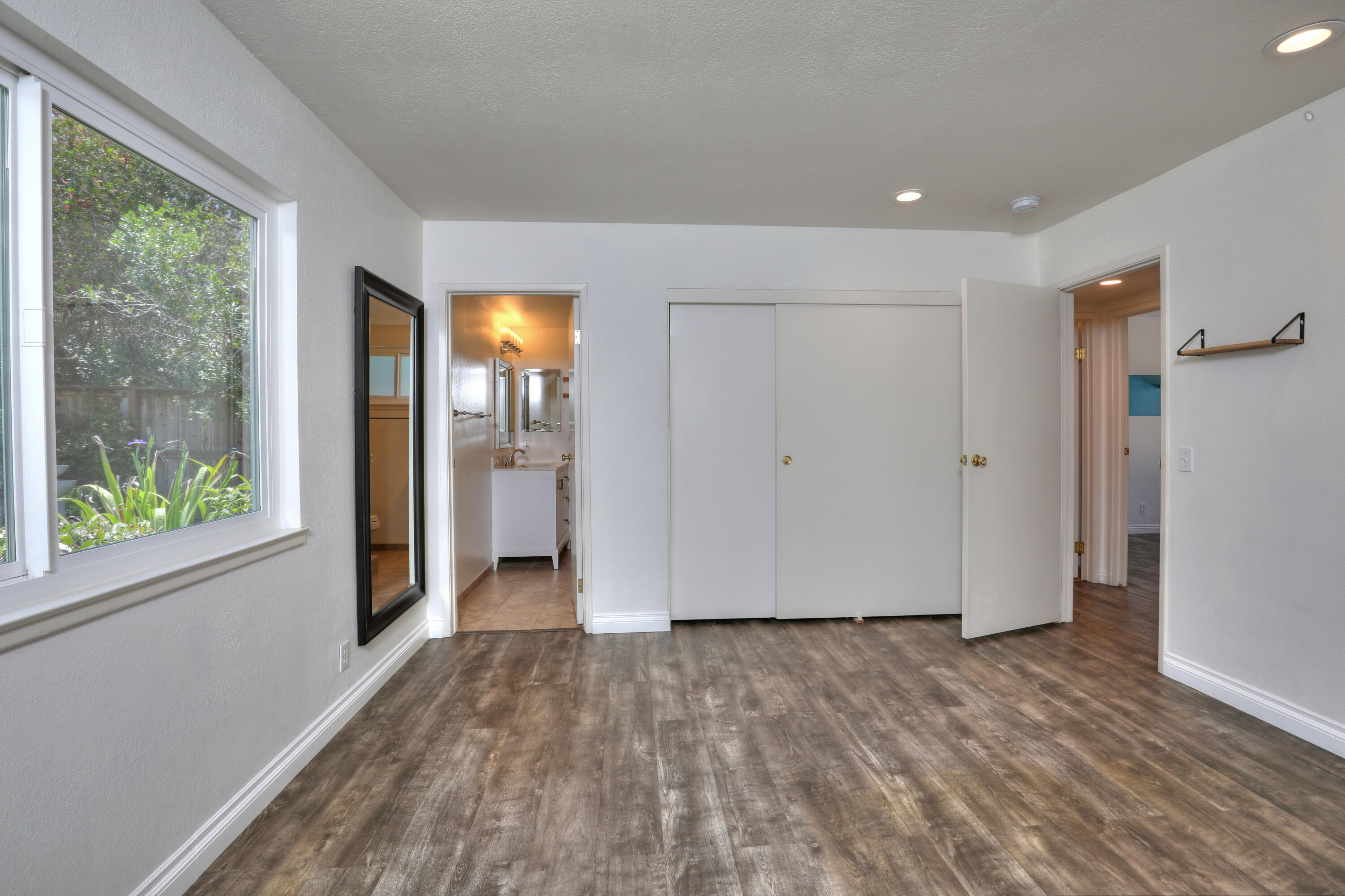 488 Wakefield Road Goleta, CA 93117 - Photo 18 of 34 a view of hallway with a large window and wooden floor