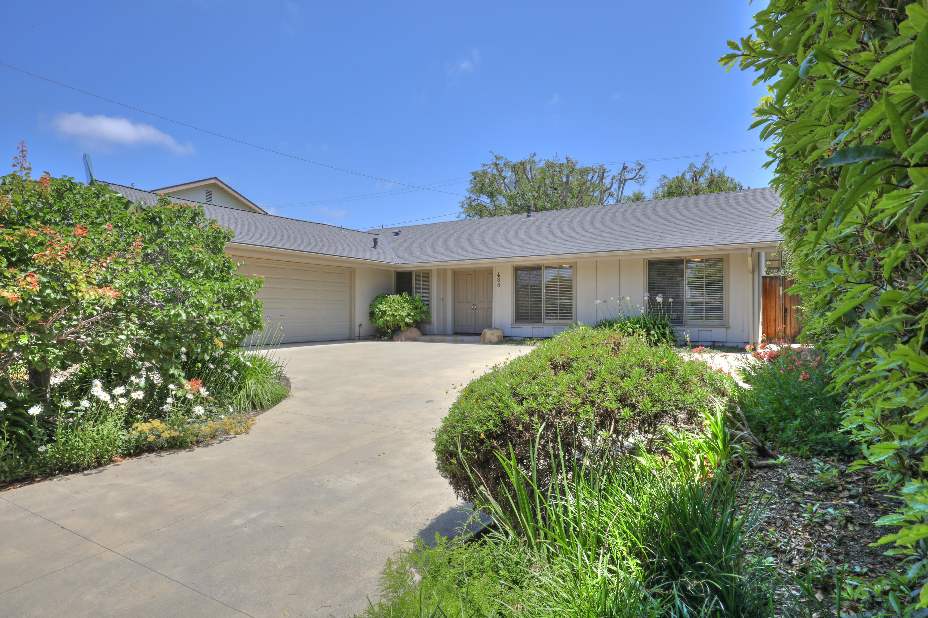 488 Wakefield Road Goleta, CA 93117 - Photo 2 of 34 a front view of a house with a garden