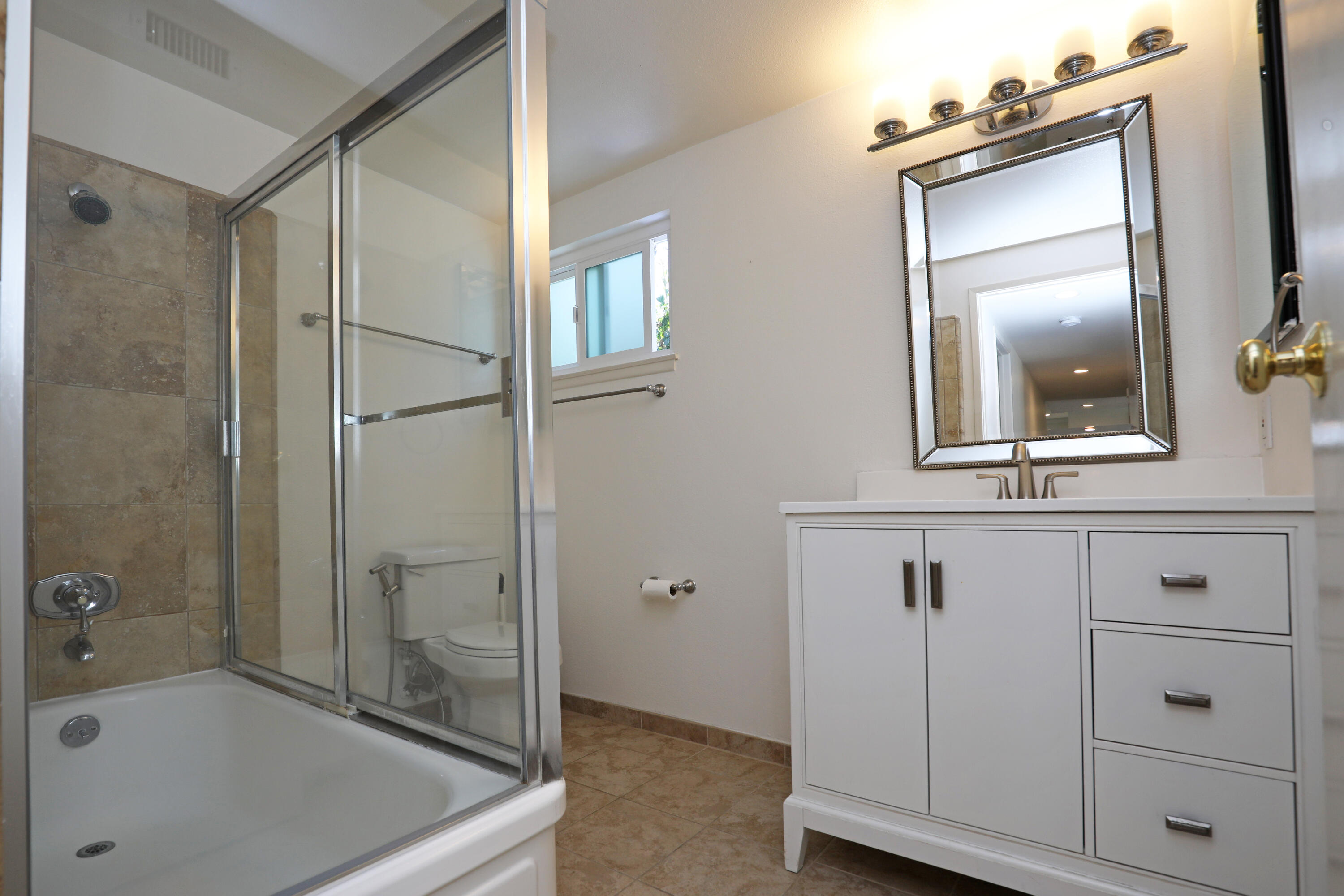 488 Wakefield Road Goleta, CA 93117 - Photo 23 of 34 a bathroom with a shower tub and mirror