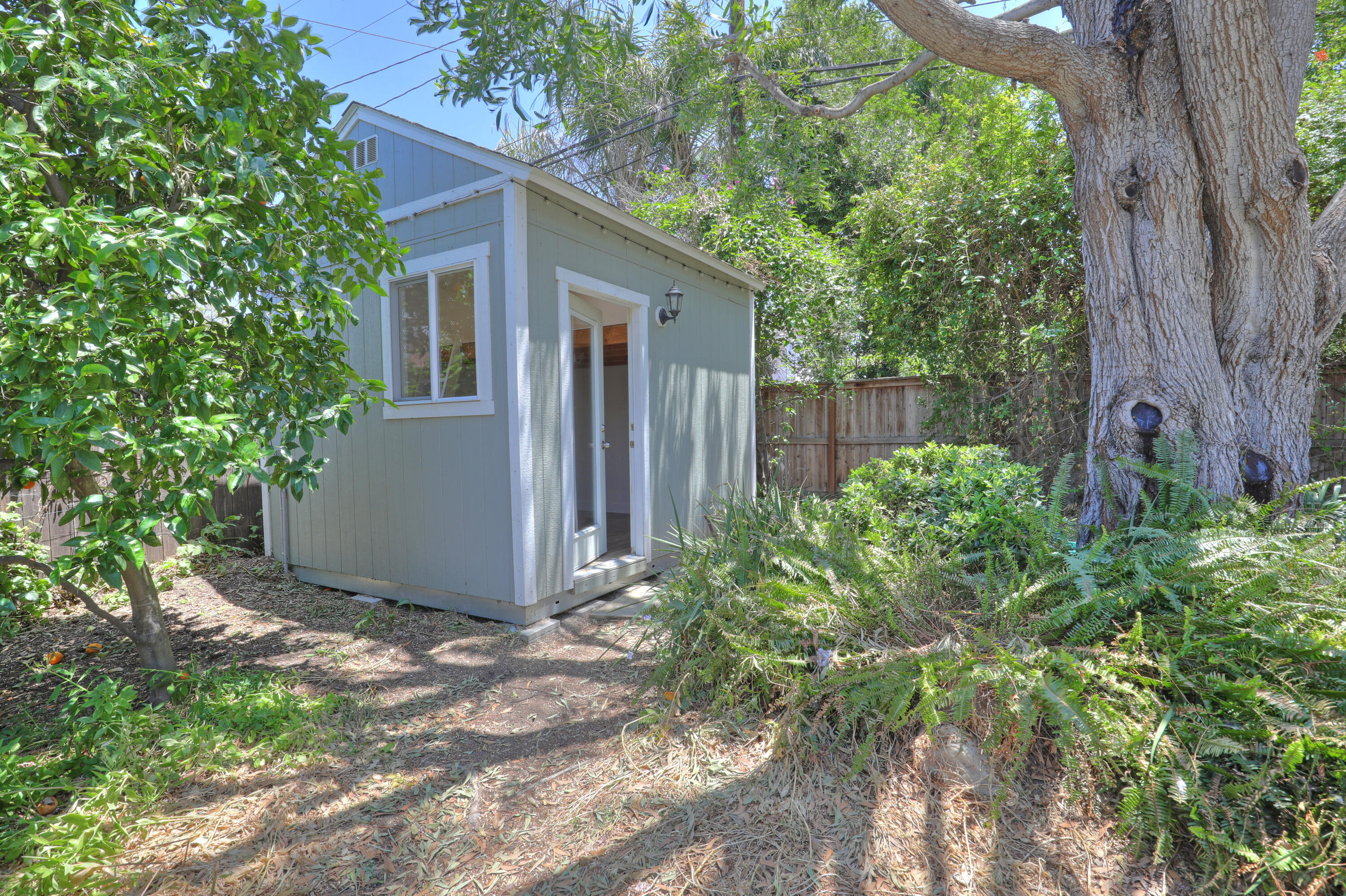 488 Wakefield Road Goleta, CA 93117 - Photo 29 of 34 a view of a small yard in front of a house with large tree