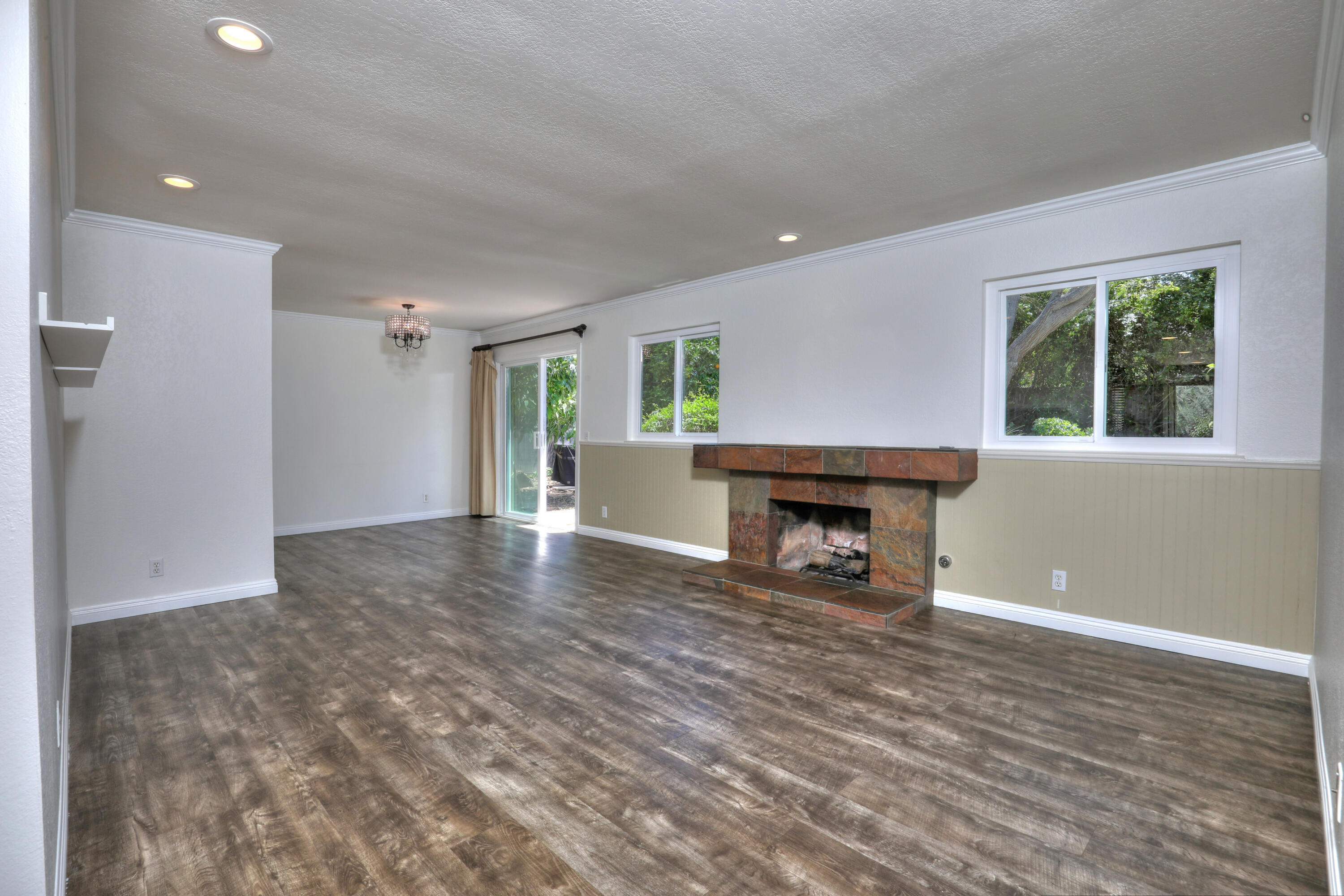 488 Wakefield Road Goleta, CA 93117 - Photo 5 of 34 a view of empty room with floor to ceiling window and fireplace