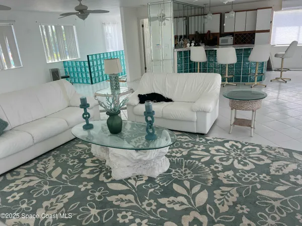 a living room with furniture and a rug