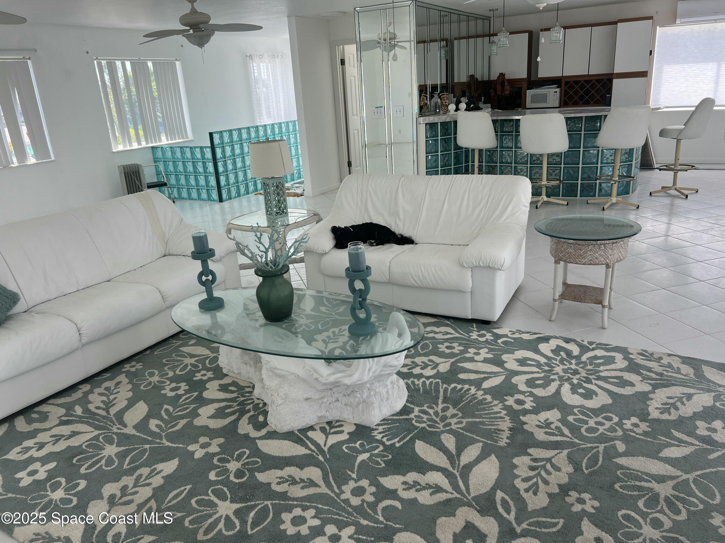 345 South Point Court Satellite Beach, FL 32937 - Photo 13 of 27 a living room with furniture and a rug