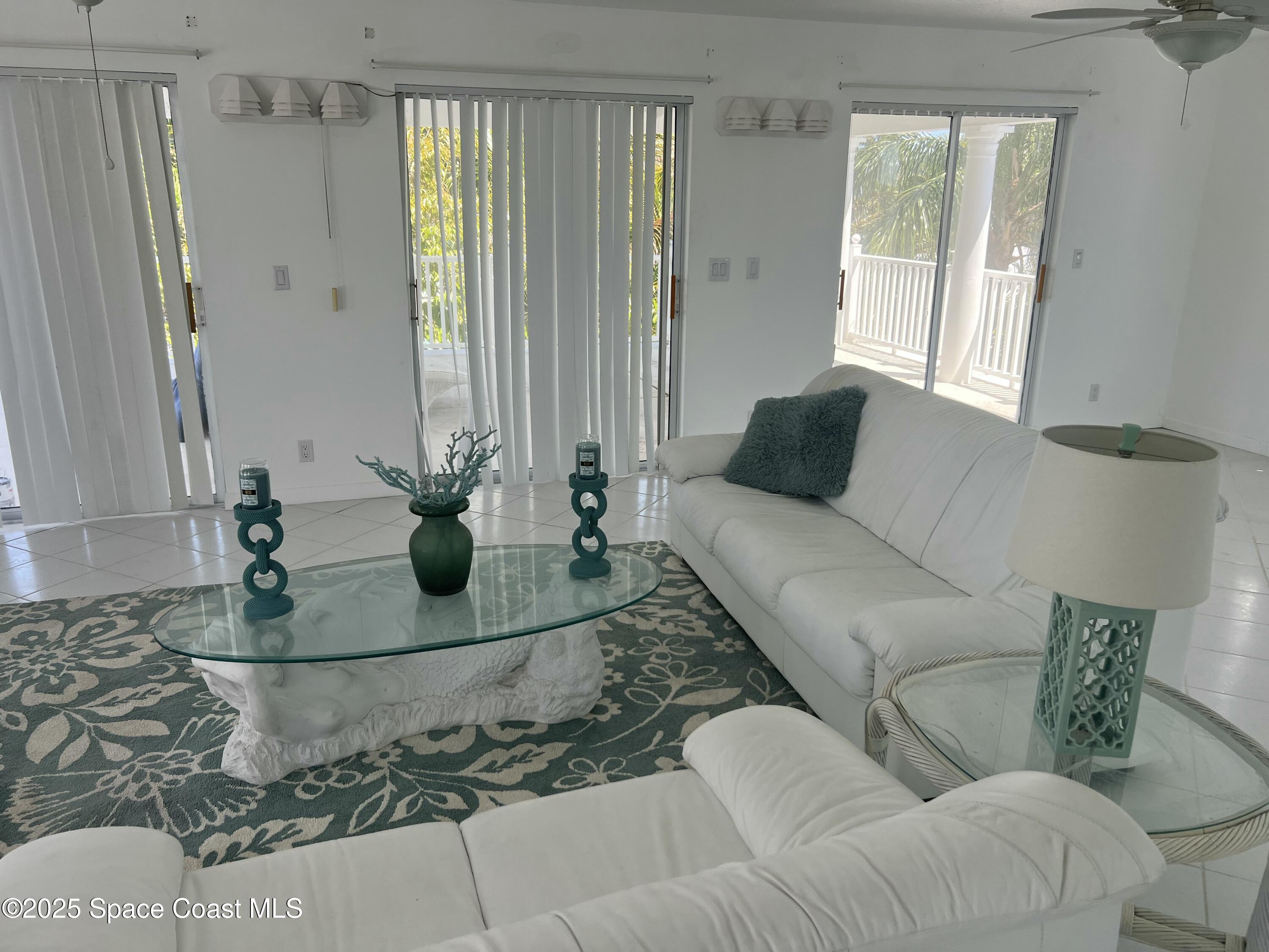 345 South Point Court Satellite Beach, FL 32937 - Photo 16 of 27 a living room with furniture and a potted plant