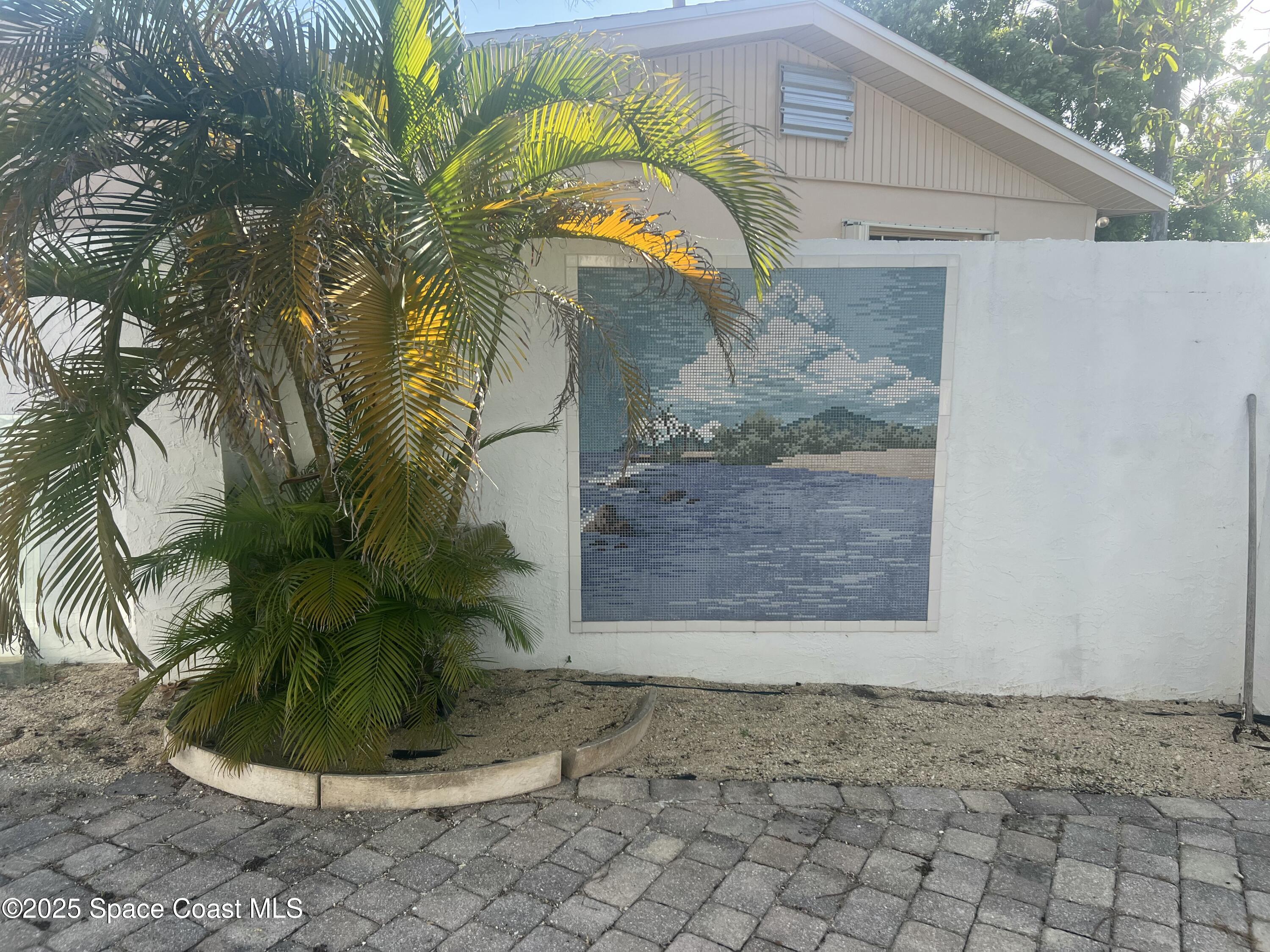 345 South Point Court Satellite Beach, FL 32937 - Photo 22 of 27 a view of a plant in a yard