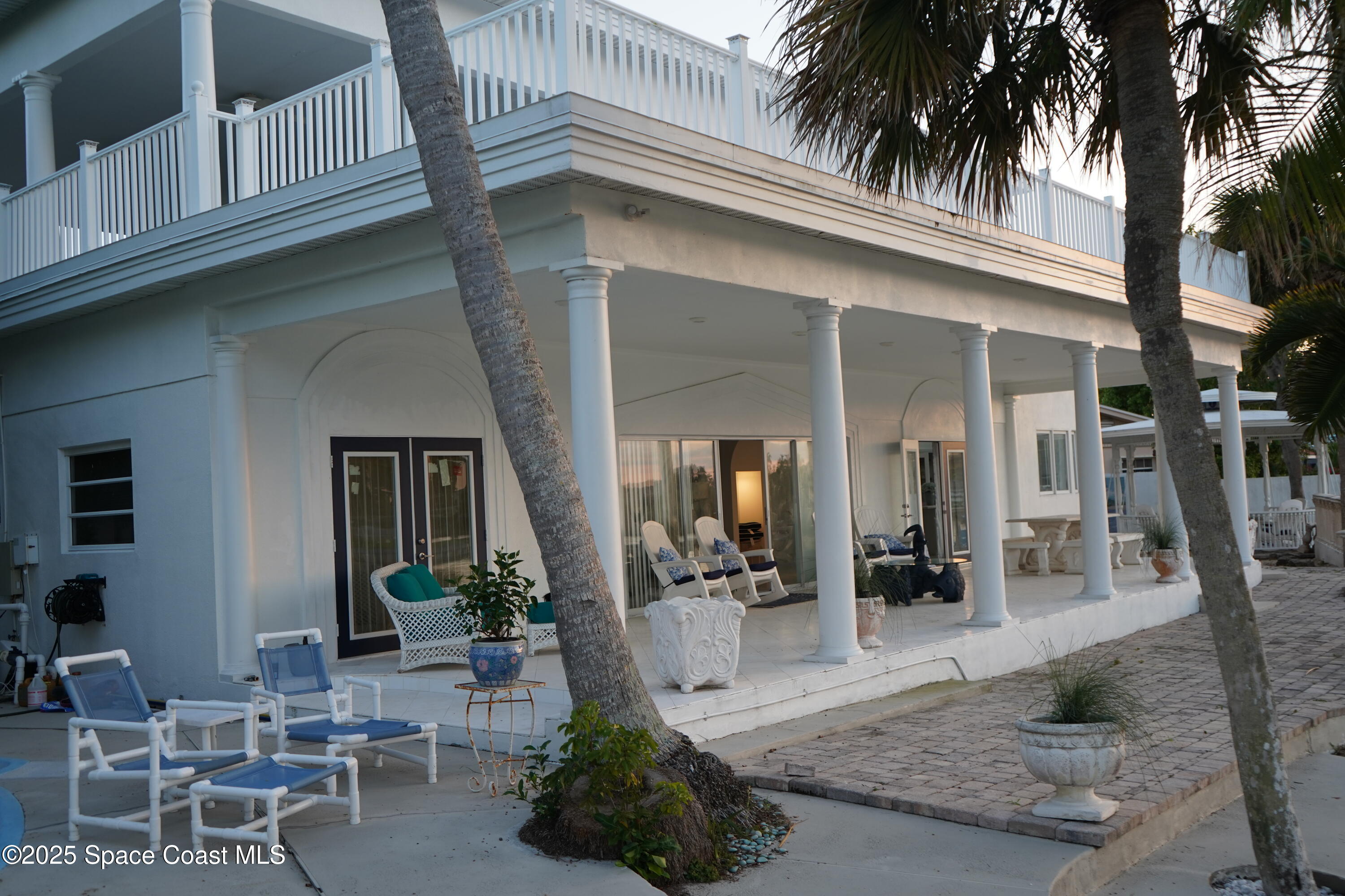 345 South Point Court Satellite Beach, FL 32937 - Photo 25 of 27 a view of a house with patio