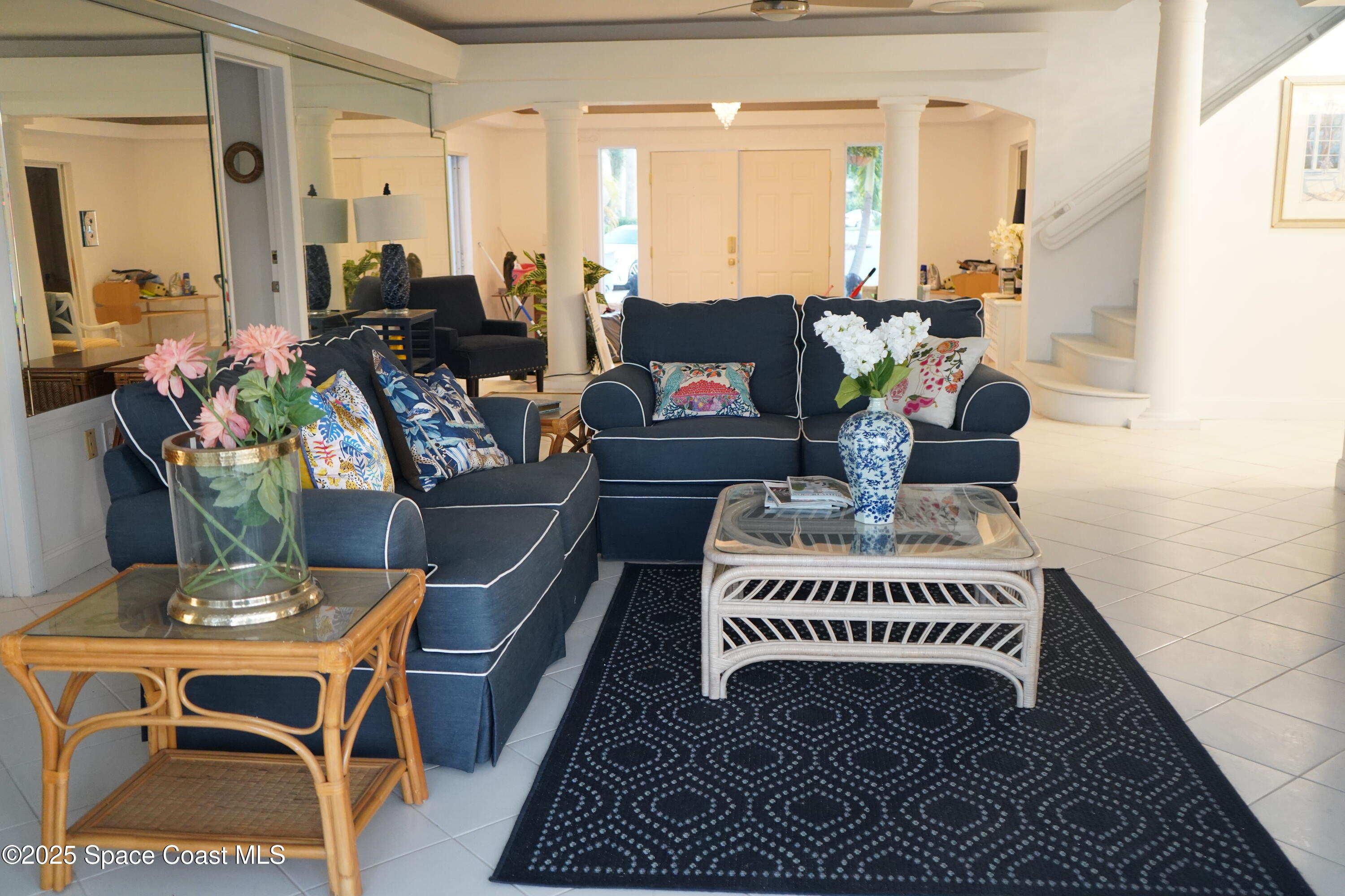 345 South Point Court Satellite Beach, FL 32937 - Photo 6 of 27 a living room with furniture a piano and a rug