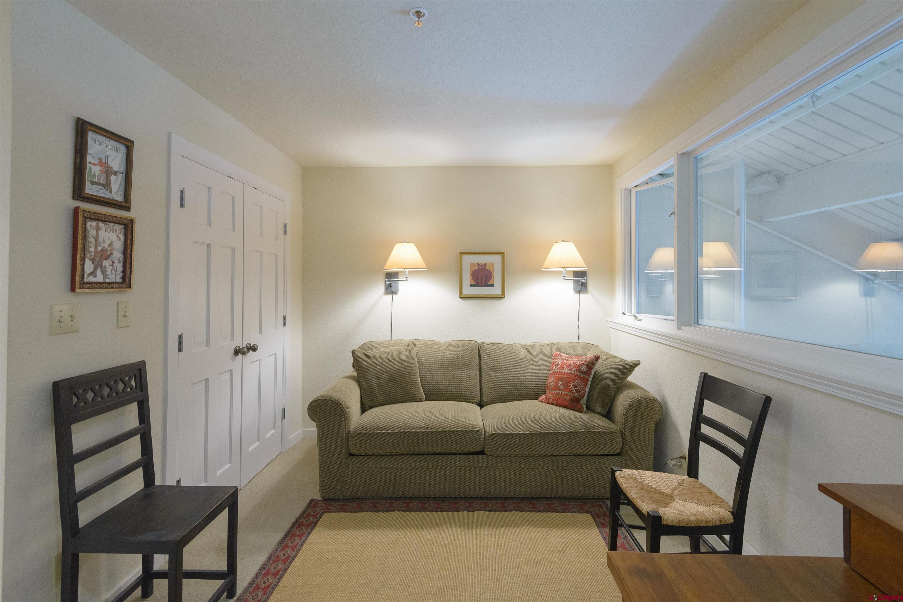 12 Snowmass Road, Unit 416 Crested Butte, CO 81225 - Photo 23 of 35 a living room with furniture and a window