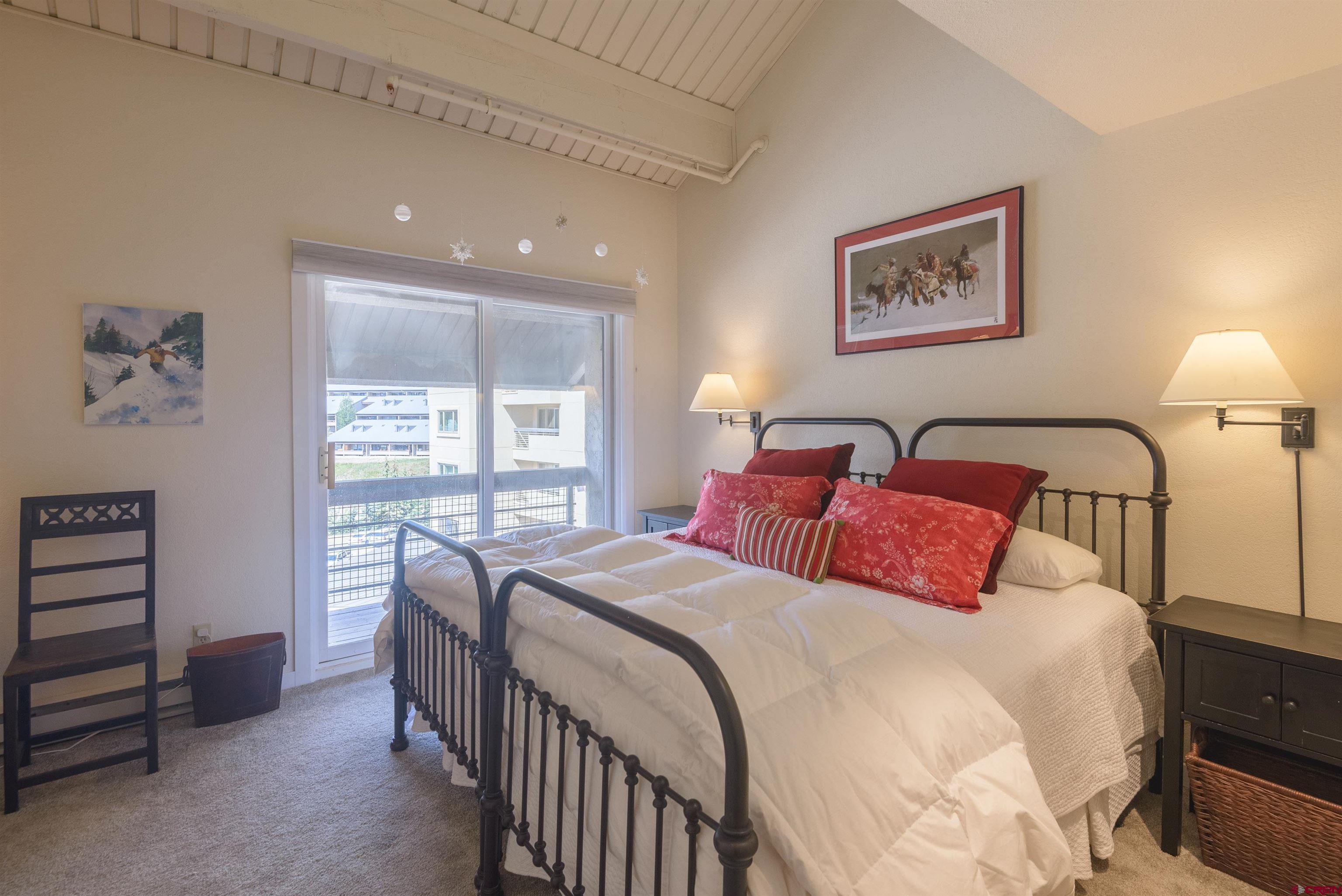 12 Snowmass Road, Unit 416 Crested Butte, CO 81225 - Photo 25 of 35 a bedroom with double bed and a window